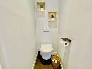 a small bathroom with a toilet in a room at L'Atelier des bords de l'Eure in Chartres +10 photos