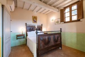 a bedroom with a bed in a room at Podere San Selvatico in Città della Pieve +41 photos