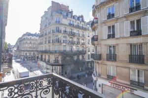 a view of a city street with tall buildings at 24 - Luxury Home in Paris Montorgueil in Paris