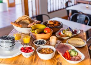 a table with a bunch of food on it at Auberge & Campagne in Saint-Férréol-les-Neiges