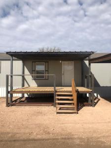 a small house with a bench and a porch at The Villa - Amazingly Comfortable King Beds in Alpine
