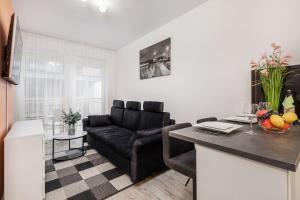 Zona d'estar a Apartamenty Kapitański Mostek by Renters