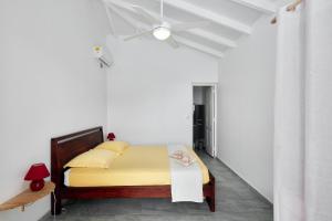 Postel nebo postele na pokoji v ubytování Villa Corail + 9 fotografií