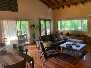a living room with a couch and a table at CARPINCHO AMARILLO in Tigre