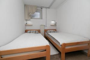 Postel nebo postele na pokoji v ubytování Apartman Gomirje