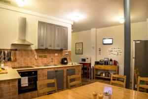 a kitchen with a sink and a counter top at Antique Hostel in Bucharest