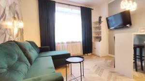 TV a/nebo společenská místnost v ubytování Daszyńskiego 18 by Homeprime