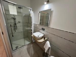 a bathroom with a shower and a toilet and a sink at Al Mare da Francesca in Olbia