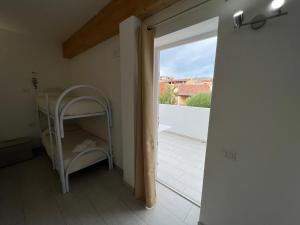 an open door to a room with a balcony at Al Mare da Francesca in Olbia