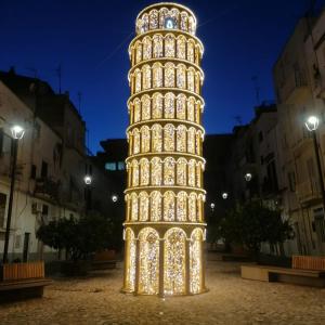 a christmas light sculpture of the leaning tower of pisa at I 23 PASSI GAETA in Gaeta