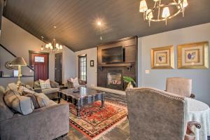 a living room filled with furniture and a fireplace at Breezy Point Escape with Views, Dock and Fire Pit! in Breezy Point