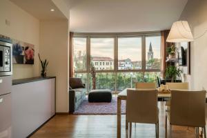 a kitchen and dining room with a view of a building at Portus Appartamenti in Portogruaro