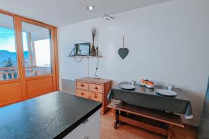 a kitchen with a sink and a counter top at Studio Coulet - Welkeys in LʼHuez