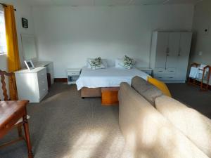 Ένα ή περισσότερα κρεβάτια σε δωμάτιο στο Rose Cottage