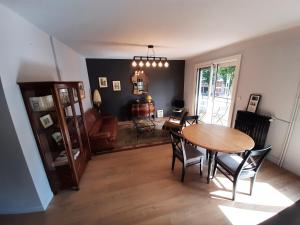 a dining room with a table and chairs at Le Planard in Rodez