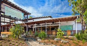 a building with a sign in front of it at BIG4 Noosa North Shore in Noosa North Shore