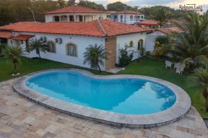 The swimming pool at or close to Por do Sol Pousada Praia