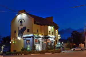 a large building with lights on the side of it at Hamilton's Bed & Breakfast in Belgorod