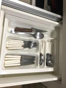a drawer full of utensils in a refrigerator at CALDAS NOVAS - GO Apartamento Parque das Aguas Quentes bloco 3 - em frente Clube Privê in Caldas Novas