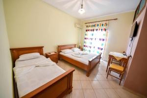 Postel nebo postele na pokoji v ubytování Hotel Geraldo