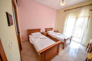 Postel nebo postele na pokoji v ubytování Hotel Geraldo