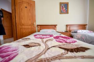 Postel nebo postele na pokoji v ubytování Hotel Geraldo