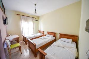 Postel nebo postele na pokoji v ubytování Hotel Geraldo