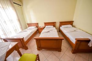Postel nebo postele na pokoji v ubytování Hotel Geraldo