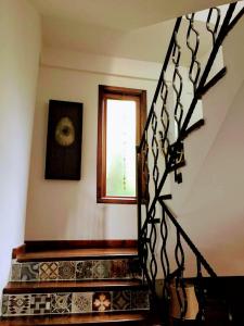 a staircase in a house with a window at Villa Defne in Tekirdağ
