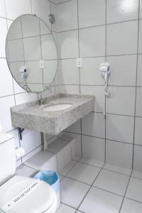 Ein Badezimmer in der Unterkunft Gran Lençóis Flat Residence (1 suíte com sala)