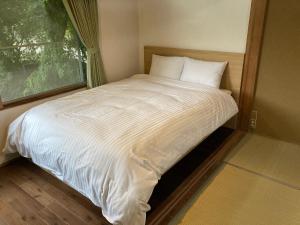 เตียงในห้องที่ Koya TRIBE - Vacation STAY 83052v