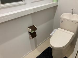 a bathroom with a white toilet and a sink at Koya TRIBE - Vacation STAY 81288v in Oishi