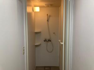 a bathroom with a shower with a shower head at Koya TRIBE - Vacation STAY 81288v in Oishi