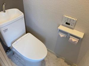 a bathroom with a white toilet and a sink at Koya TRIBE - Vacation STAY 83064v in Oishi