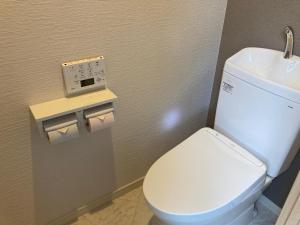 a bathroom with a white toilet and a sink at Koya TRIBE - Vacation STAY 83089v in Oishi