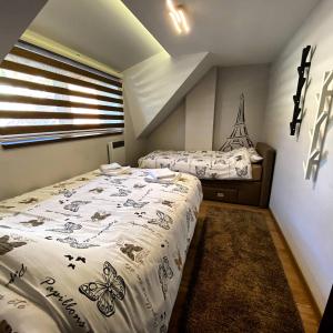 Postel nebo postele na pokoji v ubytování Casa Nostra Kop