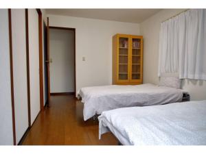 A bed or beds in a room at NYOZE House - Vacation STAY 84305v