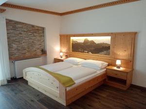 Postel nebo postele na pokoji v ubytování Hotel Garni Walter