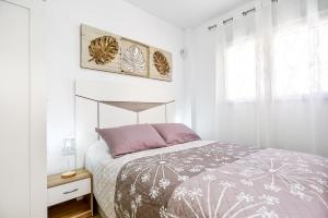 Ένα ή περισσότερα κρεβάτια σε δωμάτιο στο Apartments CURA BEACH +71 φωτογραφίες