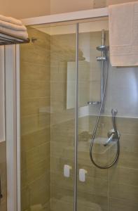 a shower with a glass door in a bathroom at Il Vicolo B&B in Milazzo