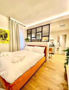 a bedroom with a large bed in a room at VicomilleSuites Cagliari Adult Only in Cagliari