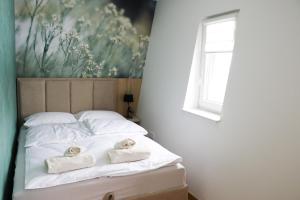 Postel nebo postele na pokoji v ubytování Apartmani VIDIK - Groodvy House
