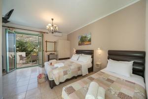 מיטה או מיטות בחדר ב-Minas Apartments