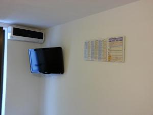 a flat screen tv hanging on a wall at Apartment Marija in Trogir