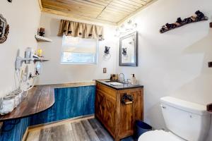 a bathroom with a sink and a toilet at Hellava View in Sevierville