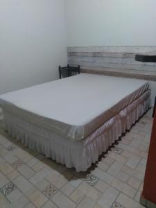 a mattress on a bed frame in a room at Chalés Bangalôs Itamambuca in Ubatuba