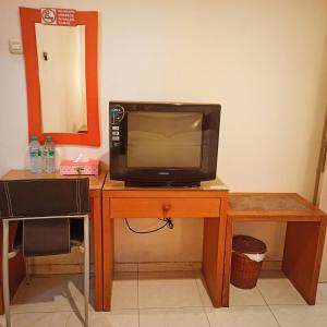 Hotel Flamboyan TV 또는 엔터테인먼트 센터