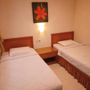 Hotel Flamboyan 객실 침대