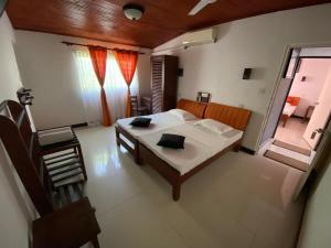Postel nebo postele na pokoji v ubytování Beach Walk Hotel Unawatuna