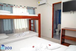 Łóżko lub łóżka w pokoju w obiekcie APARTAHOTEl SUEÑOS LIBRES